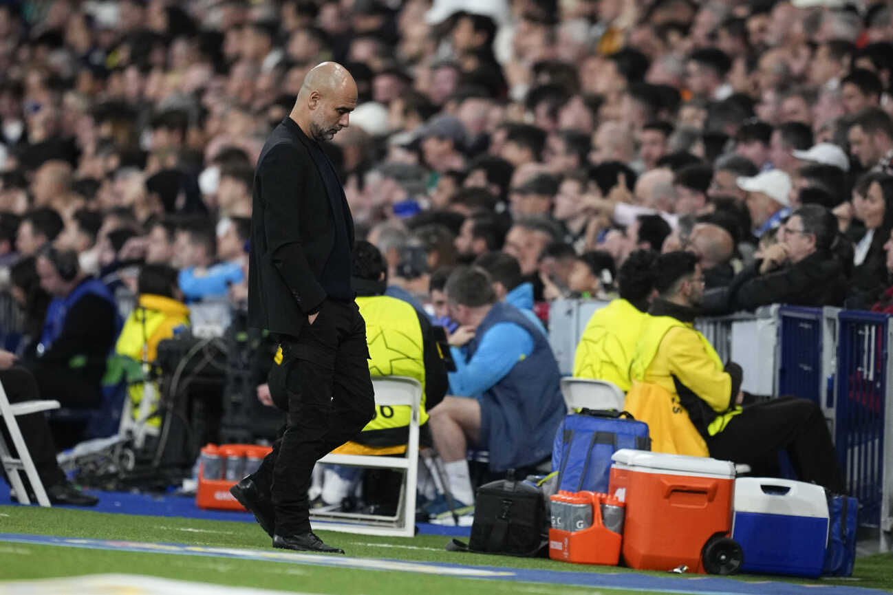 February 19, 2025, Madrid, Madrid, SPAIN: Pep Guardiola, head coach of Manchester City, looks down during the UEFA Champions League 2024 25 League Knockout Play-off second leg match between Real Madrid CF and Manchester City, at Santiago Bernabeu stadium on February 19, 2025, in Madrid, Spain. Madrid SPAIN - ZUMAa181 20250219_zaa_a181_058 Copyright: xOscarxJ.xBarrosox